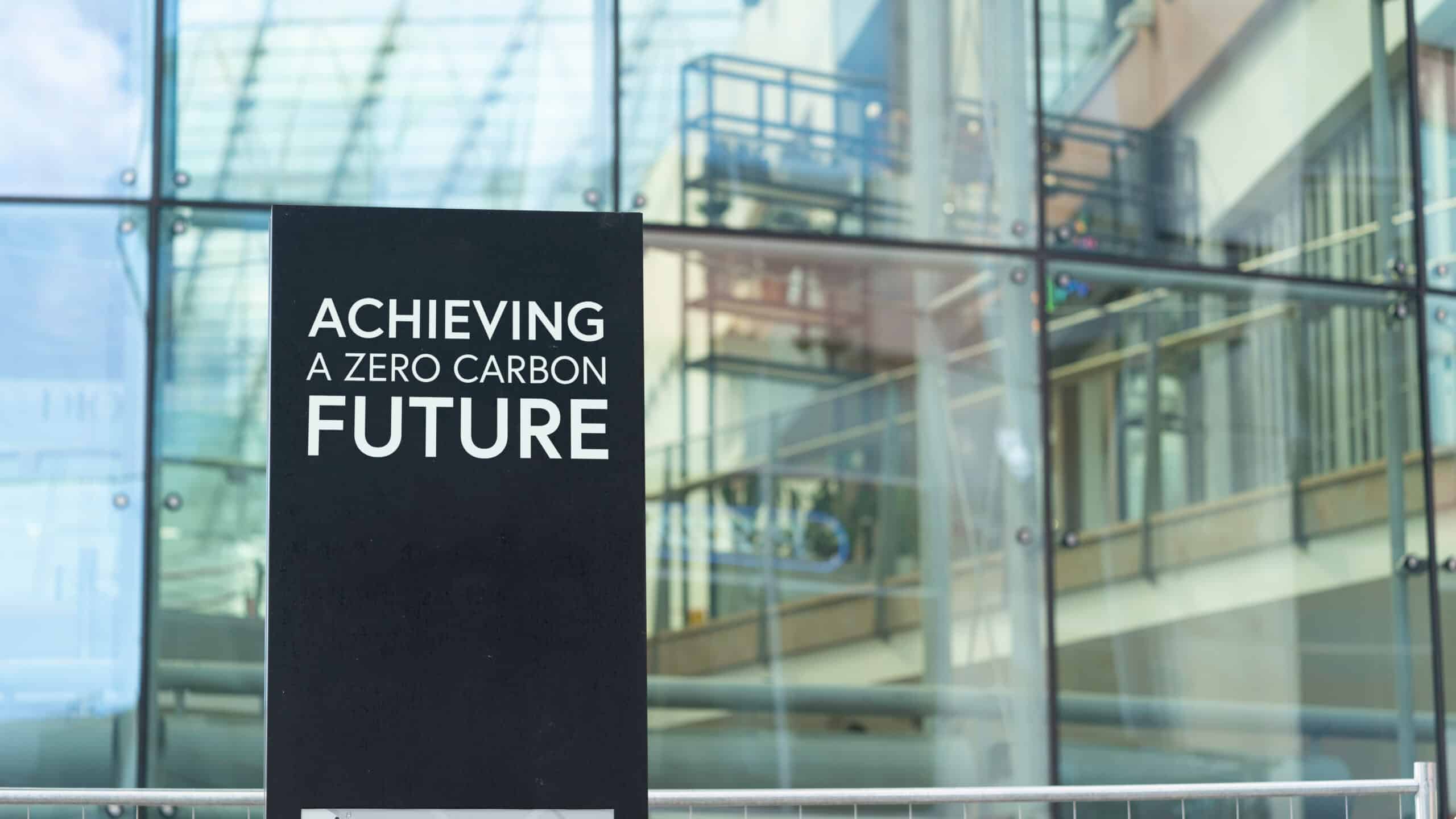 achieving-a-zero-carbon-future-on-a-city-center-sign-in-front-o