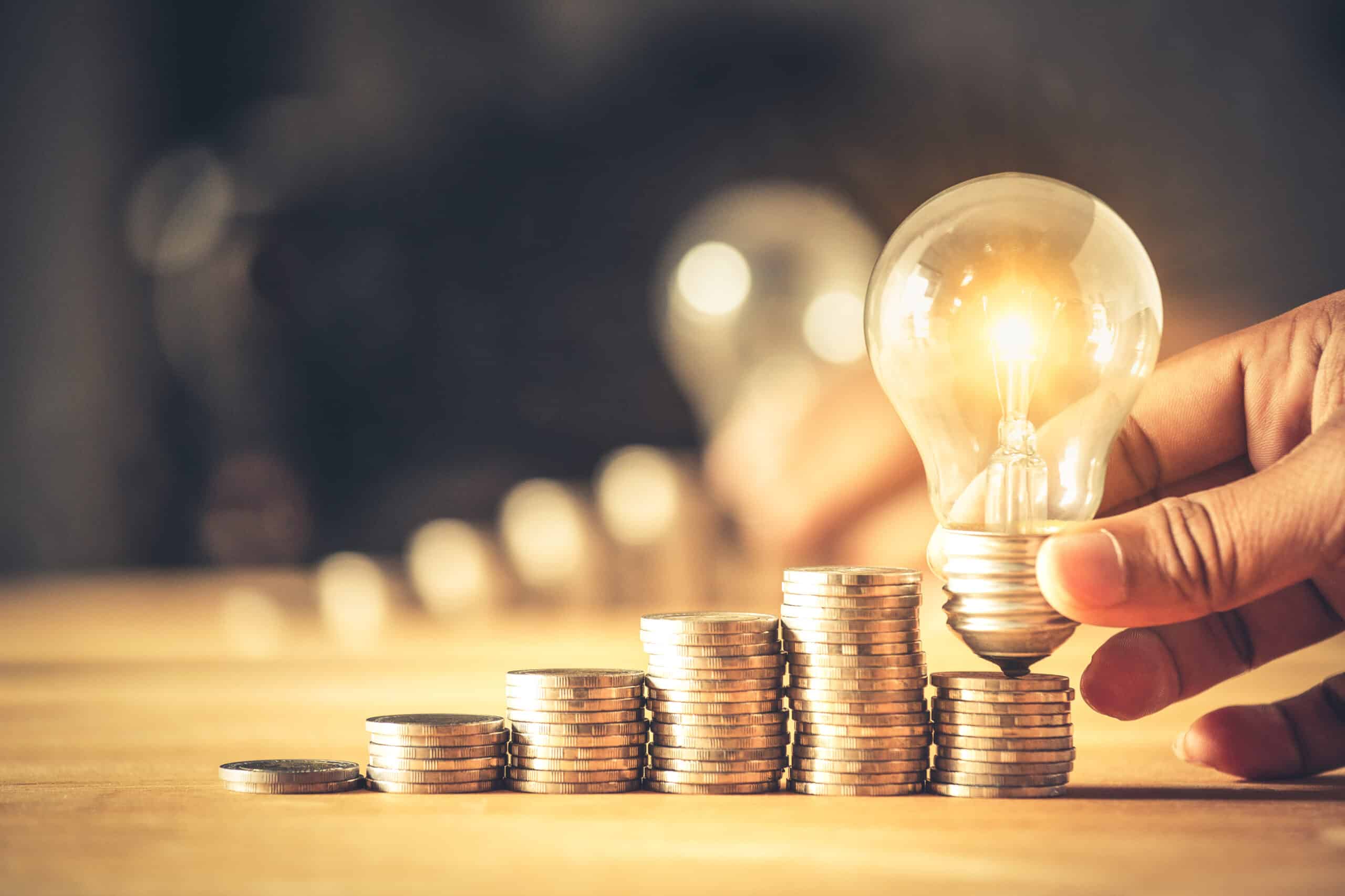 handholdingalightbulbwithcoinsstack-creativeideas
